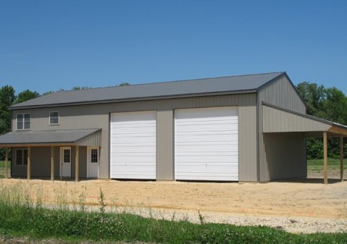 two-story pole barn with garage doors