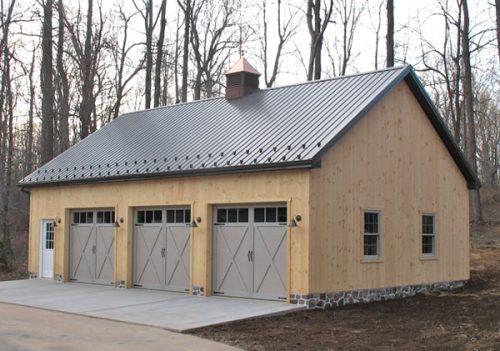 three-car garage with metal roof